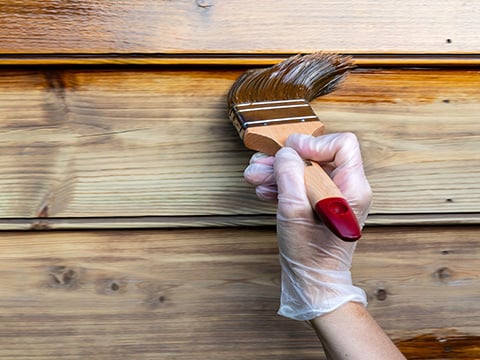 houten tuinhuis beitsen