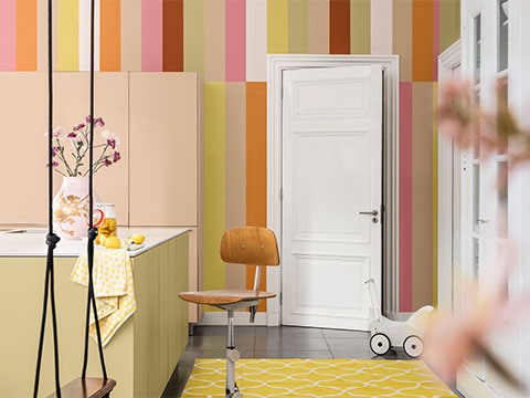 Roos, groen, oranje, beige en rode keukenmuur